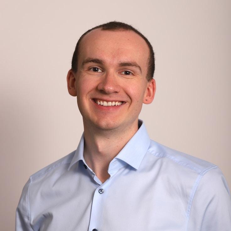 Jordan Reed, Client Relations Director, discussing corporate gifting strategy with business clients