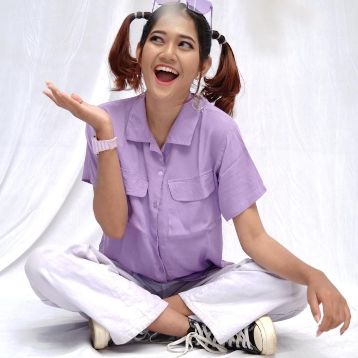 Avery Kim, Lead Design Curator at Spark Grove Harbor, reviewing corporate floral arrangements